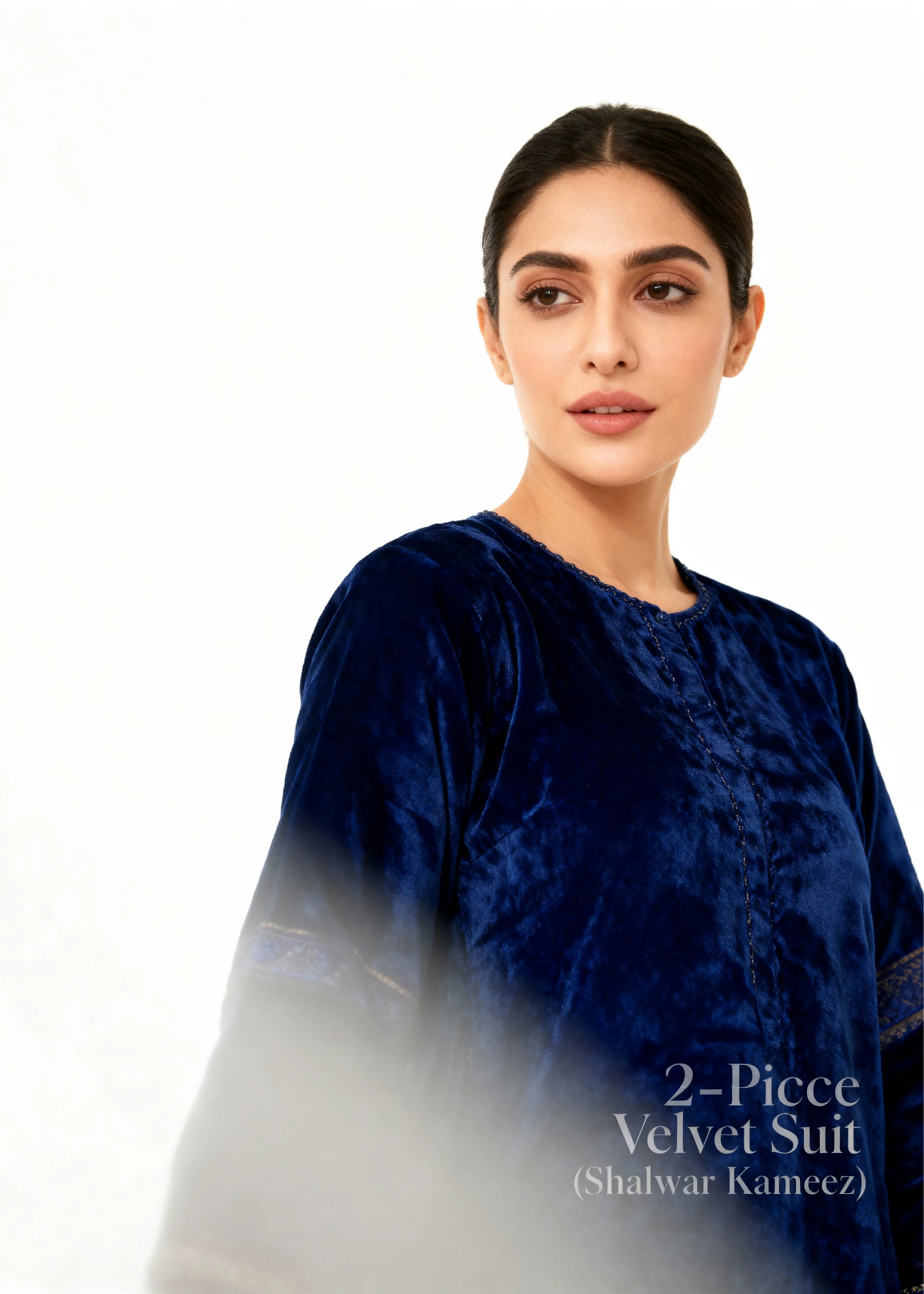 Woman wearing a blue velvet suit with text '2-Piece Velvet Suit (Shalwar Kameez)' on a white background