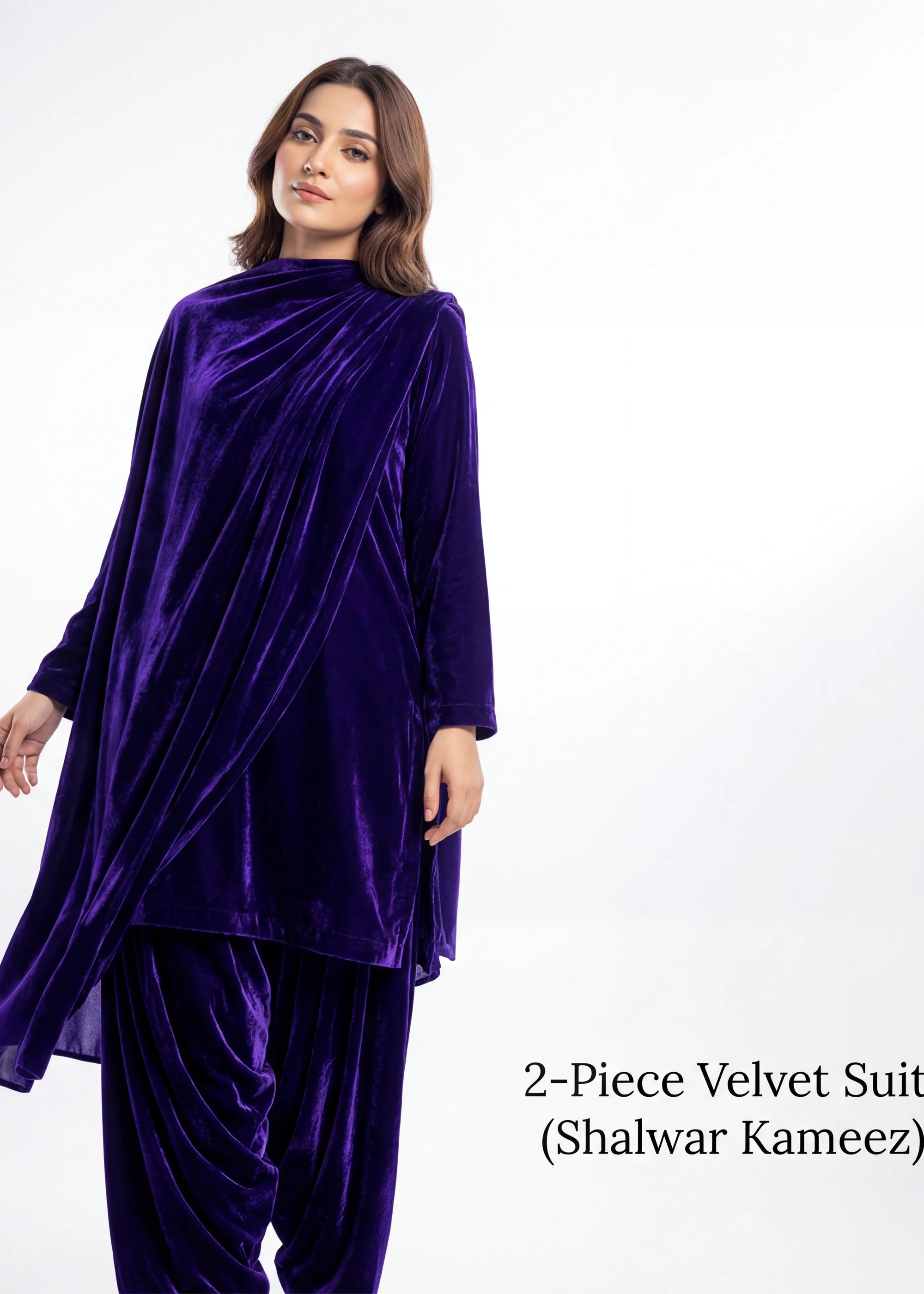 Woman wearing a two-piece velvet suit with 'Shalwar Kameez' on a white background