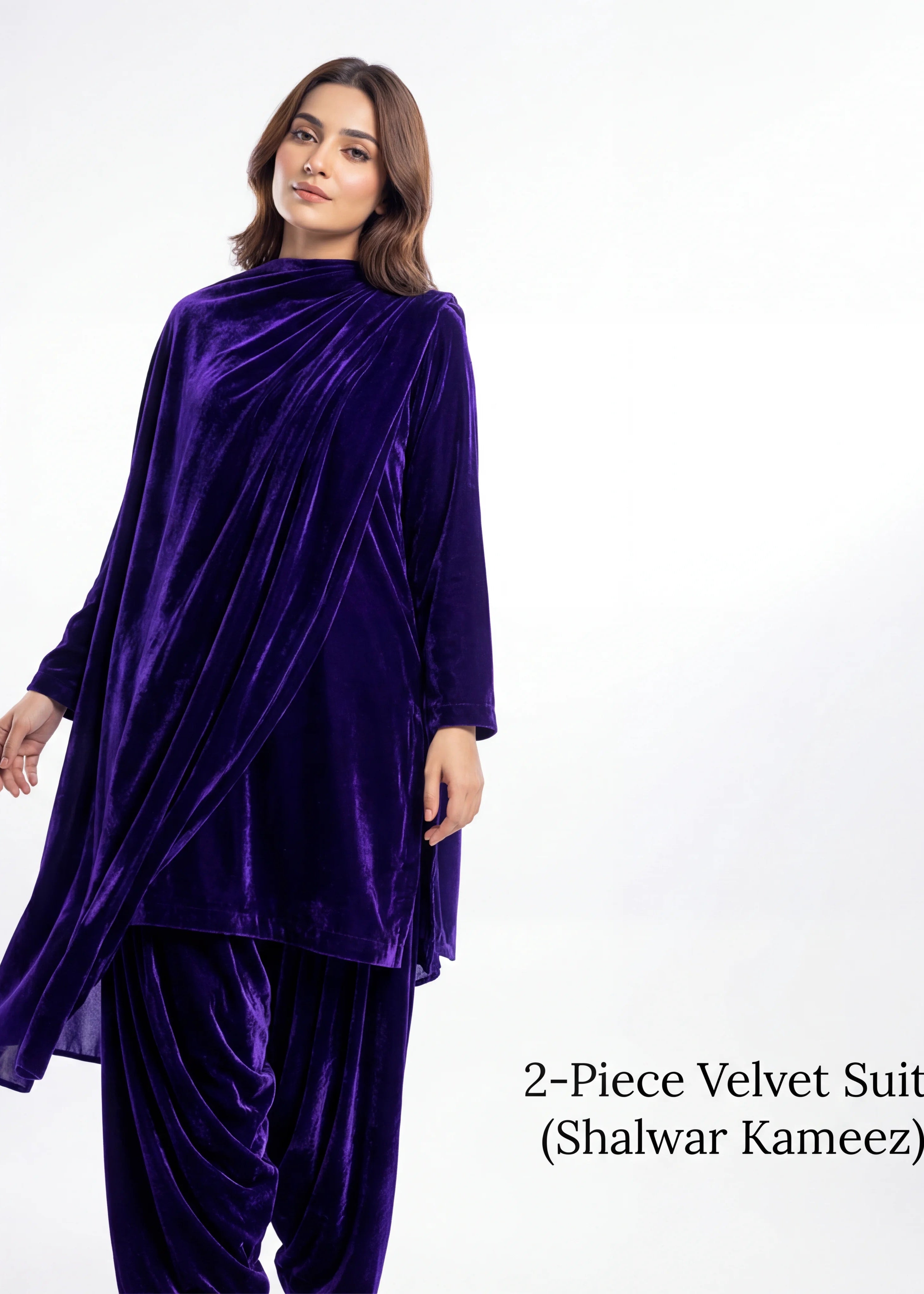 Woman wearing a two-piece velvet suit with 'Shalwar Kameez' on a white background