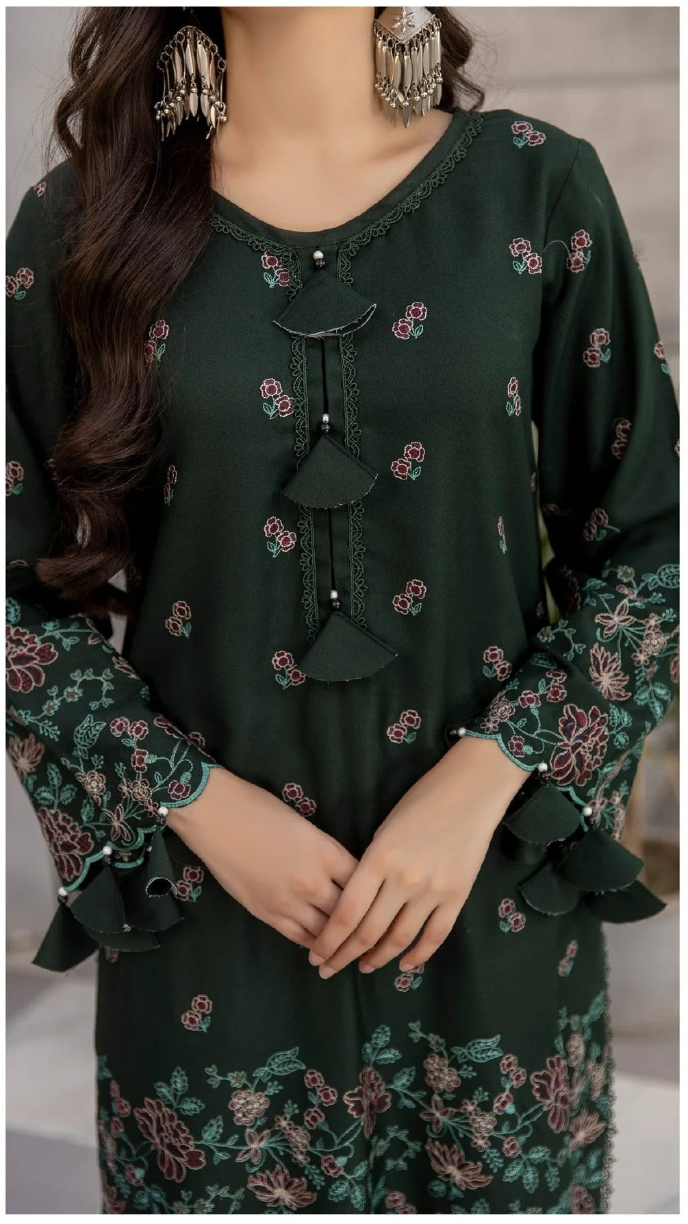 Woman wearing a green floral dress with a checkered floor background