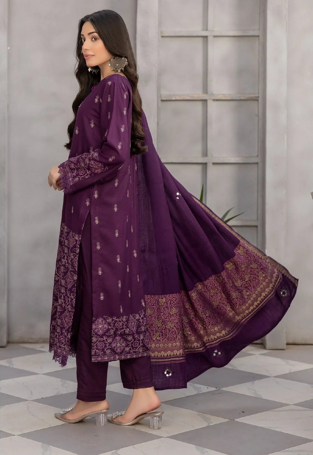 Woman in a purple traditional outfit with 'Simplify' branding.