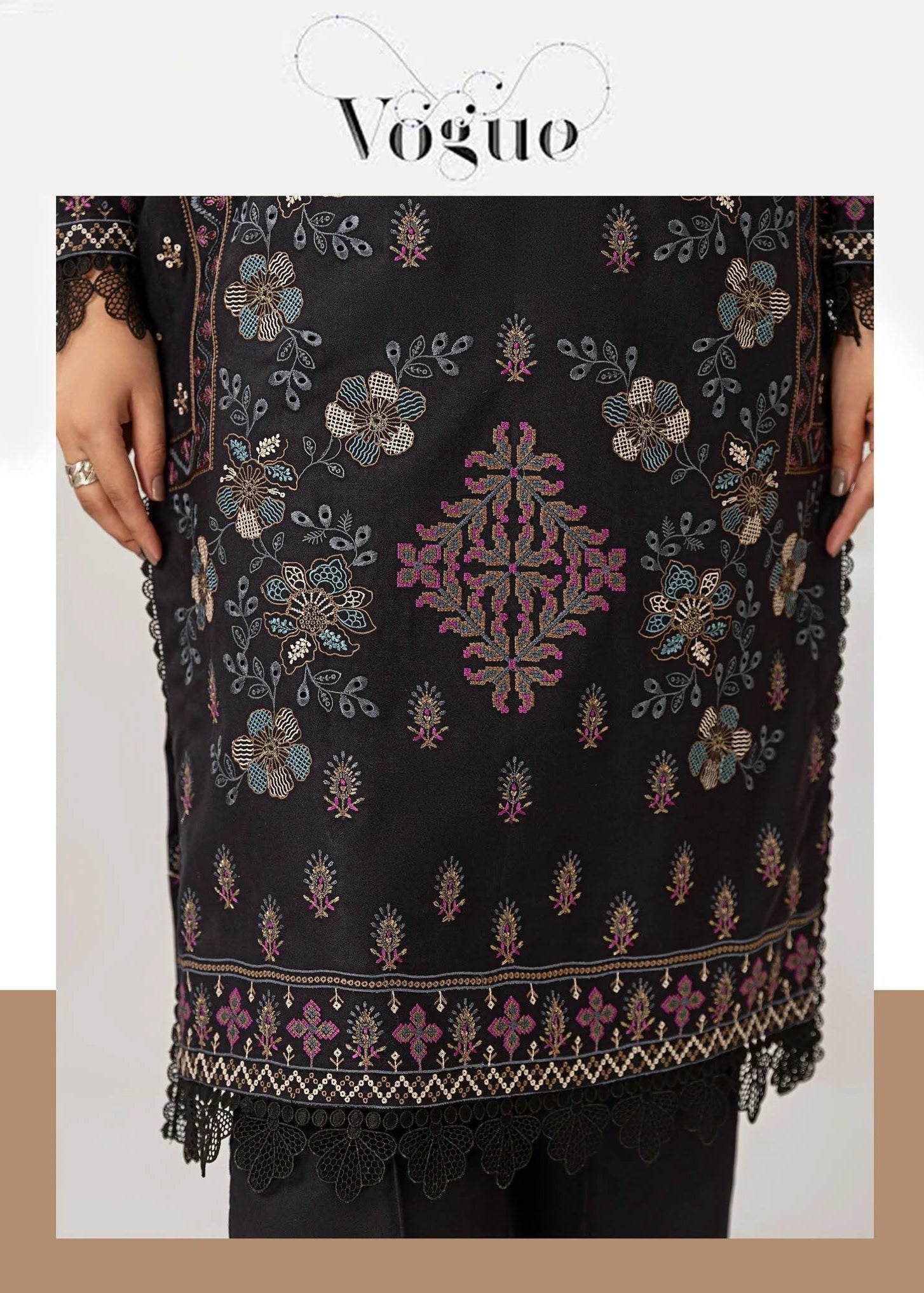 Woman wearing a black embroidered outfit with a matching scarf, with 'Vogue' branding.