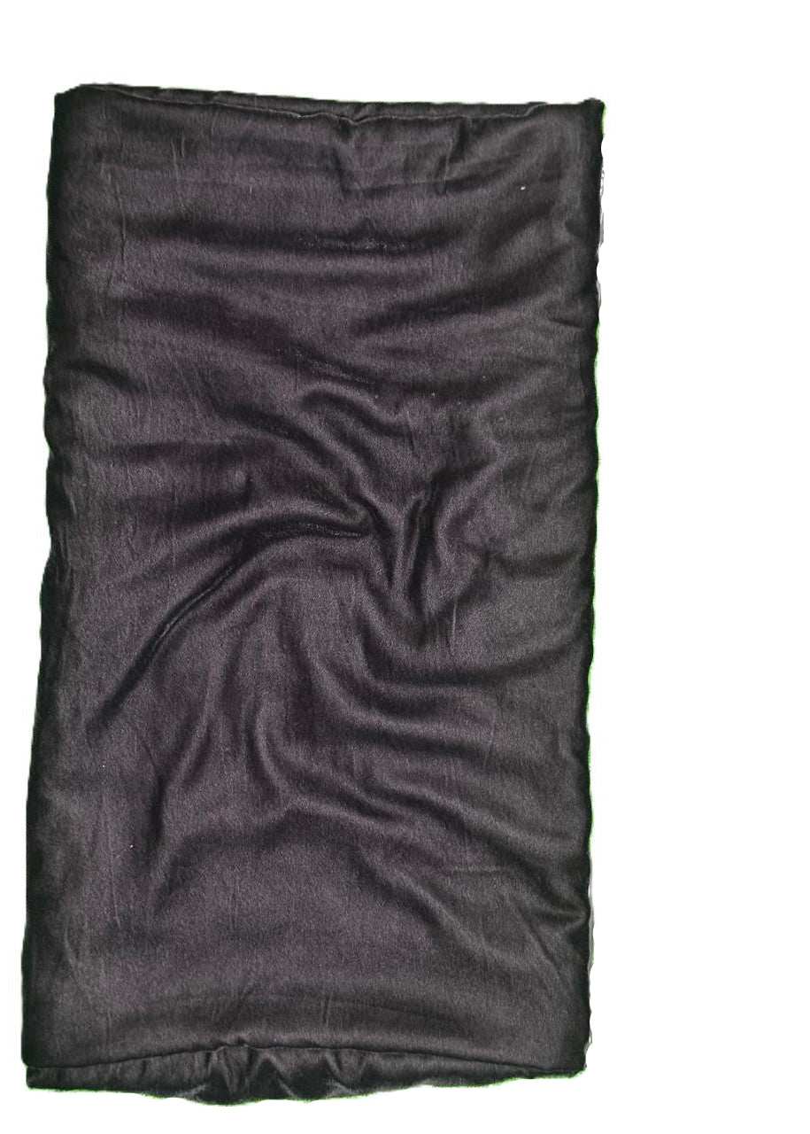 Folded black fabric on a white background