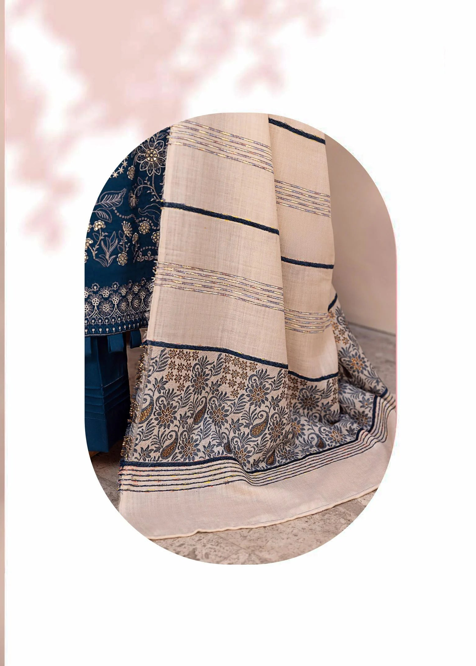 Woman wearing a blue and white traditional outfit with a close-up of the fabric.