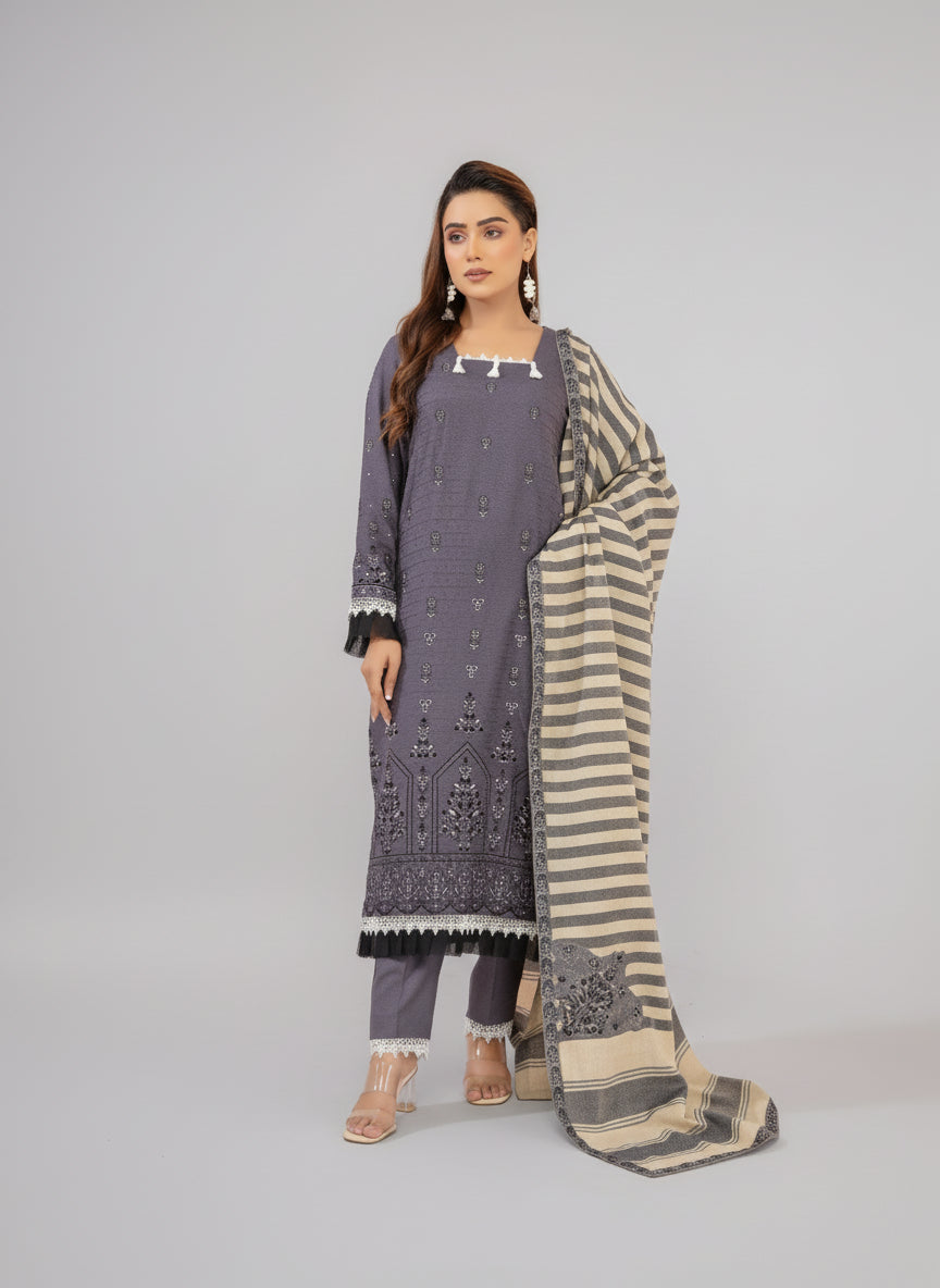 A beautiful Women Wearing Grey Embroidered suit in a Studio Room