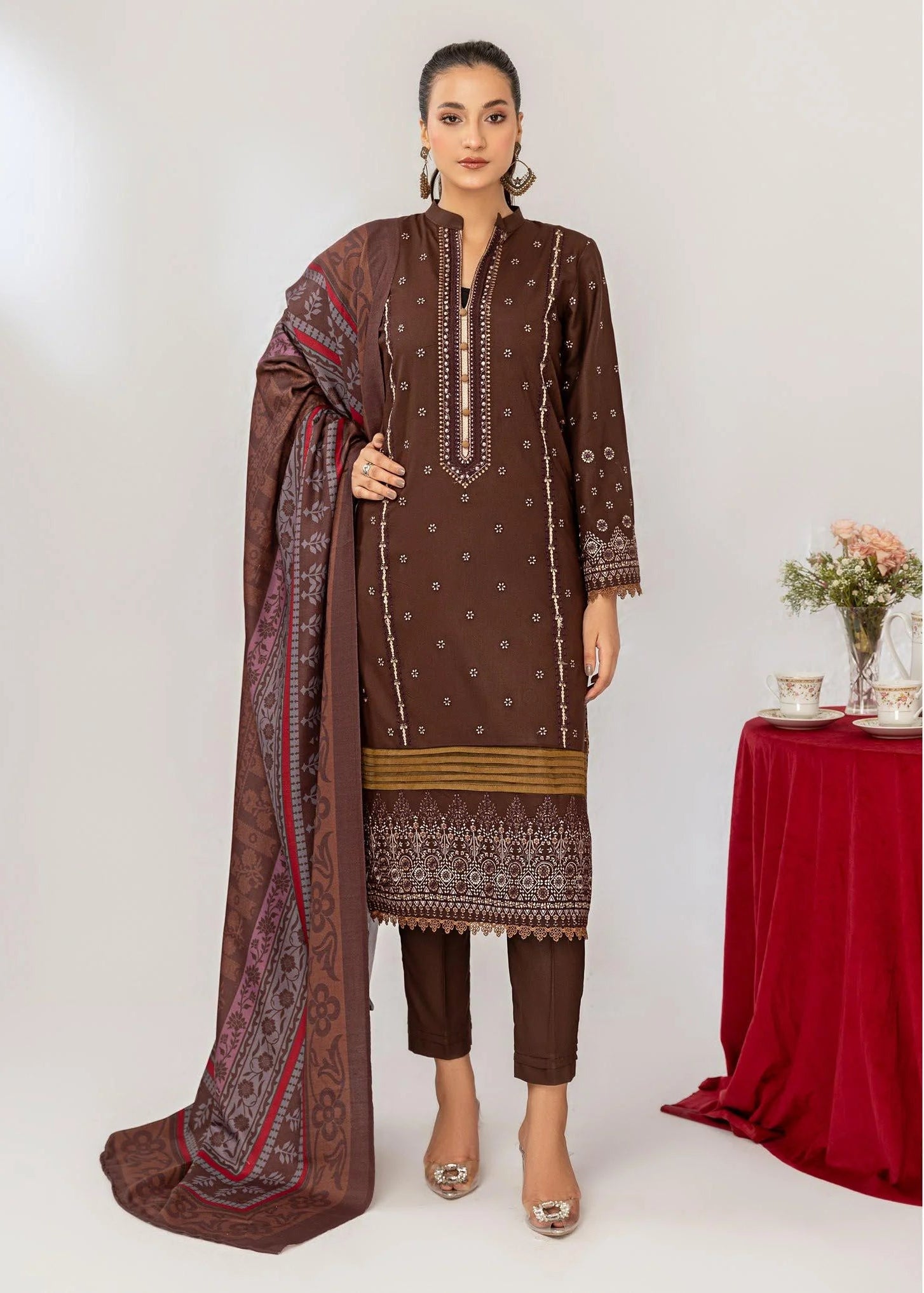 Brown embroidered outfit with matching dupatta on a white background