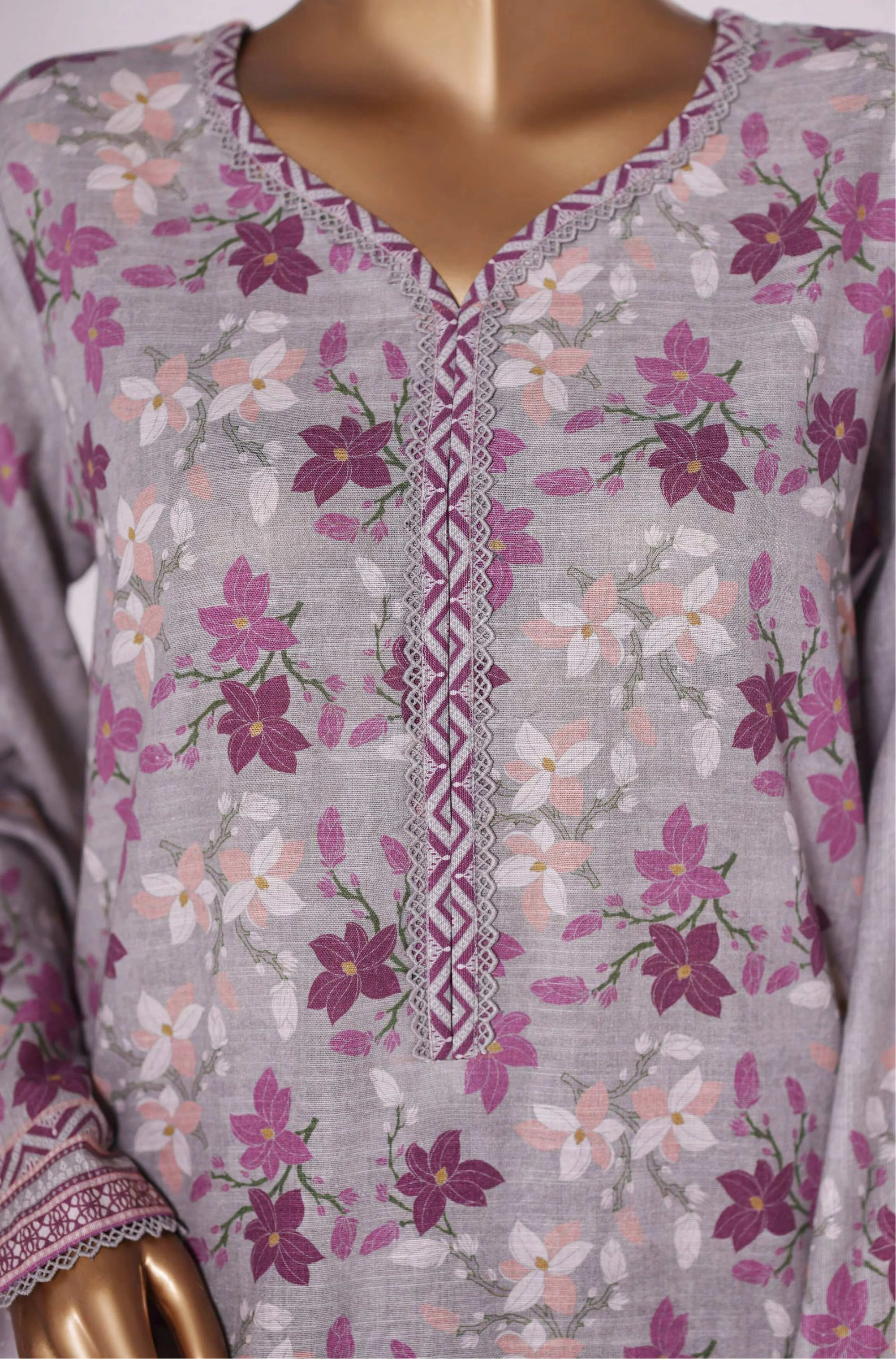 Floral patterned outfit with matching pants on a mannequin, branded 'BIN SAEEED'.