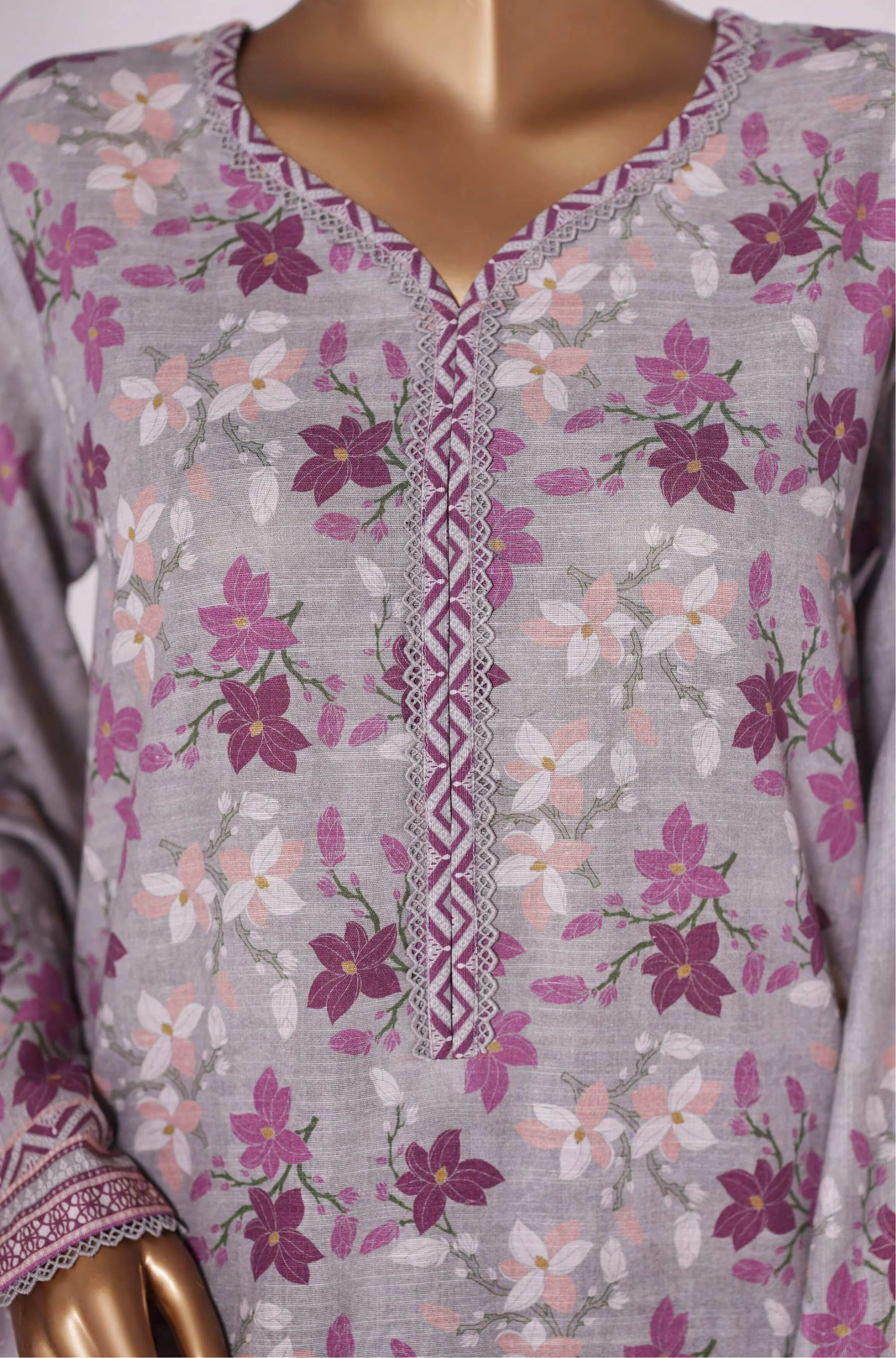 Floral patterned outfit with matching pants on a mannequin, branded 'BIN SAEEED'.