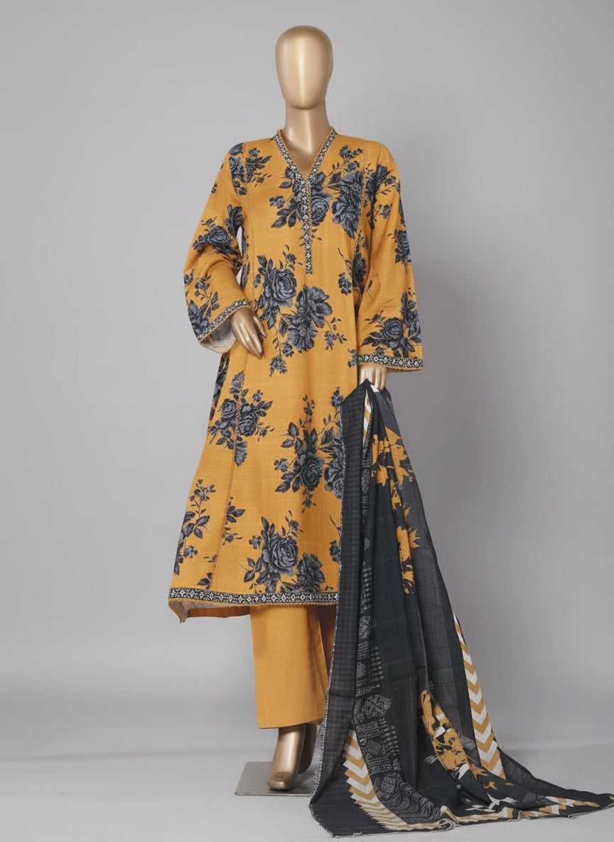 Mannequin wearing a mustard yellow and black floral printed frock with a shawl, against a neutral background.