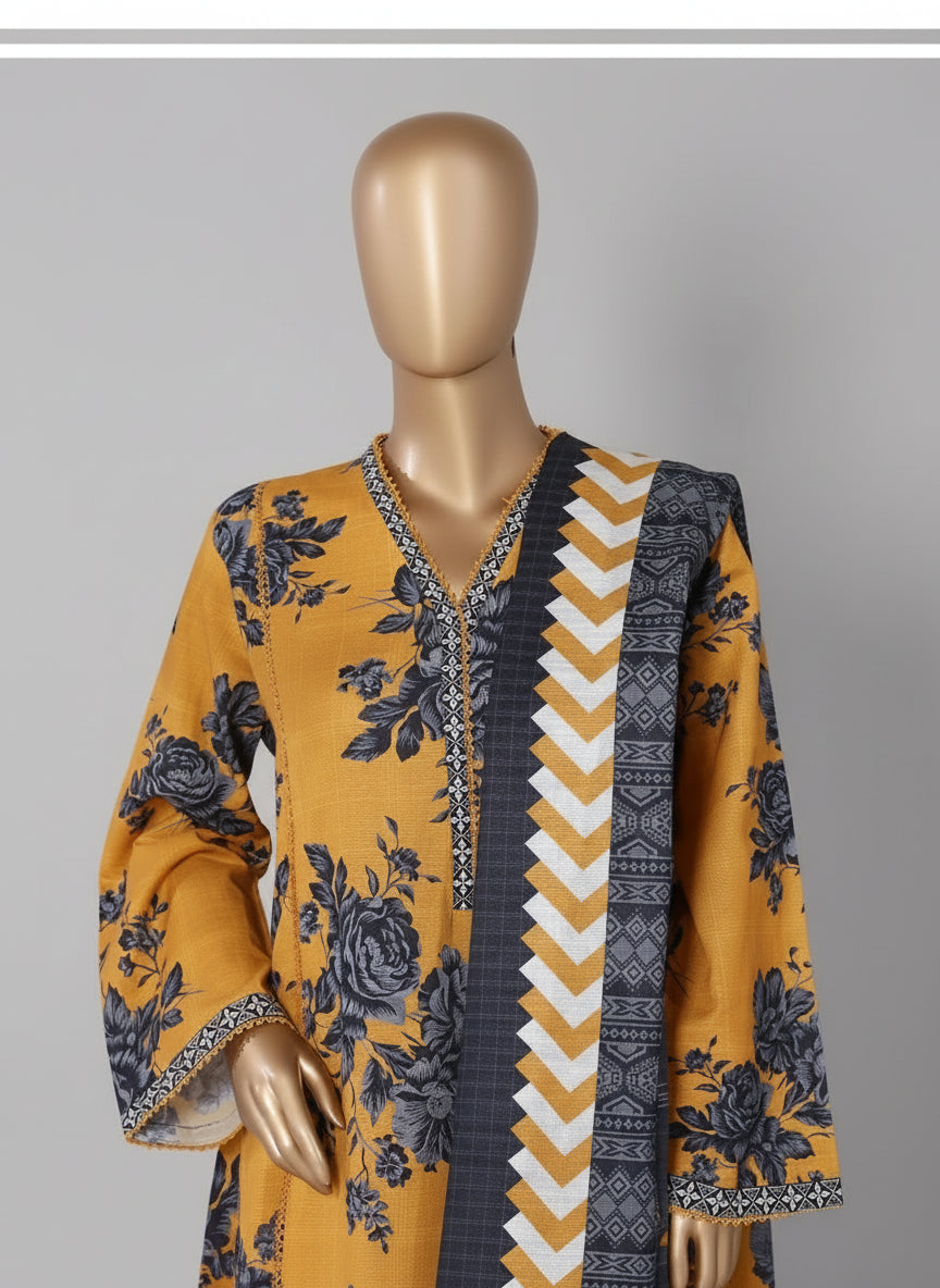 Mannequin wearing a yellow and blue patterned outfit with a decorative chair in the background.