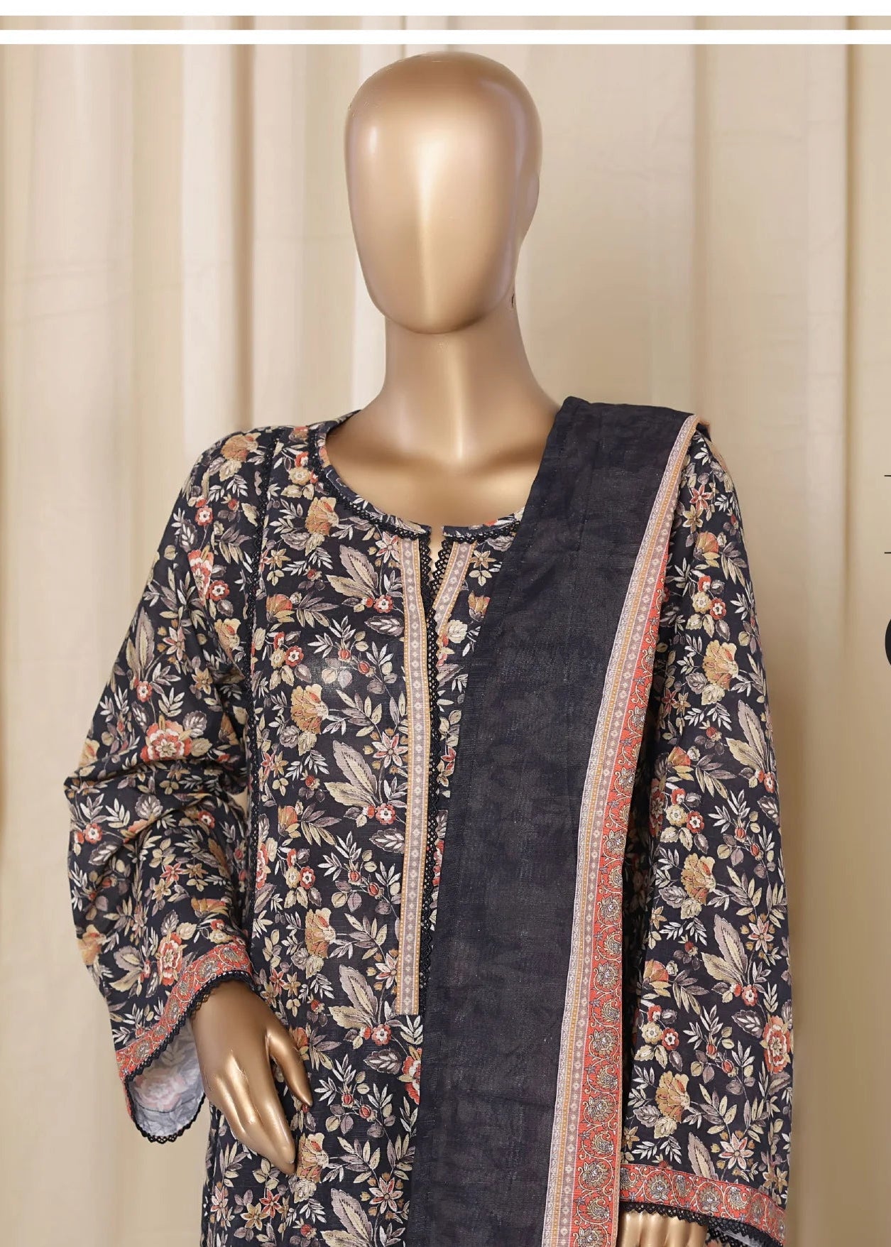 Mannequin wearing a floral and black outfit with text 'Fashion Goes Natural' on a beige curtain background.