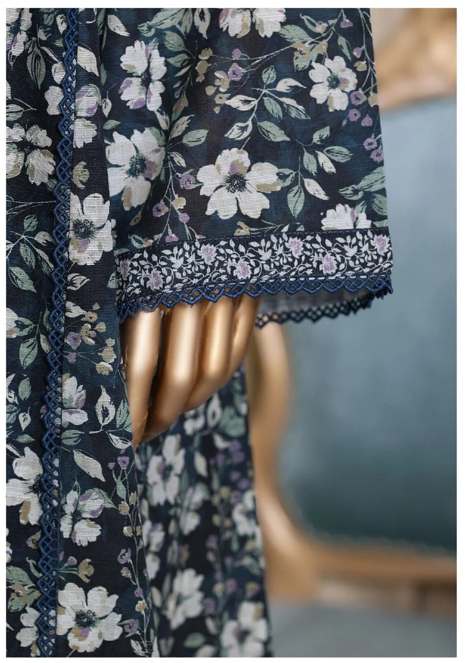 Floral dress with matching dupatta on a mannequin against a neutral background