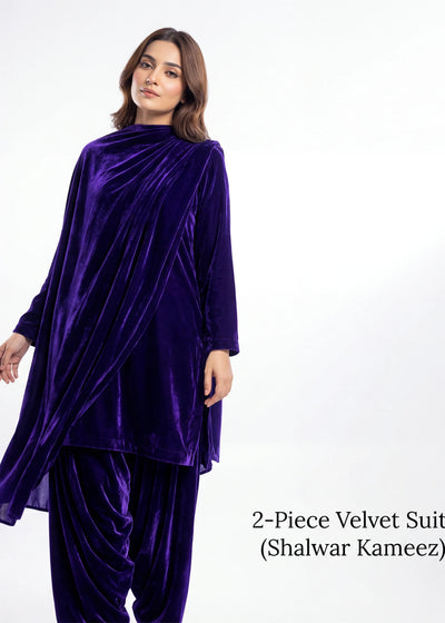 Woman wearing a two-piece velvet suit with 'Shalwar Kameez' on a white background