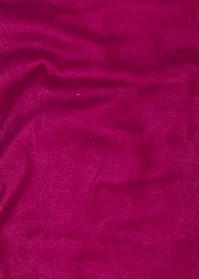 Close-up of a textured pink fabric with a white background