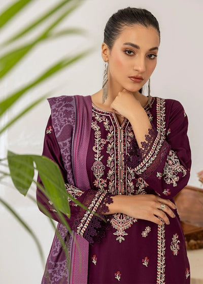 Woman wearing a purple embroidered outfit with a white background