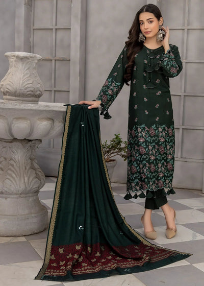 Woman holding a green dupatta with floral patterns in an indoor setting.