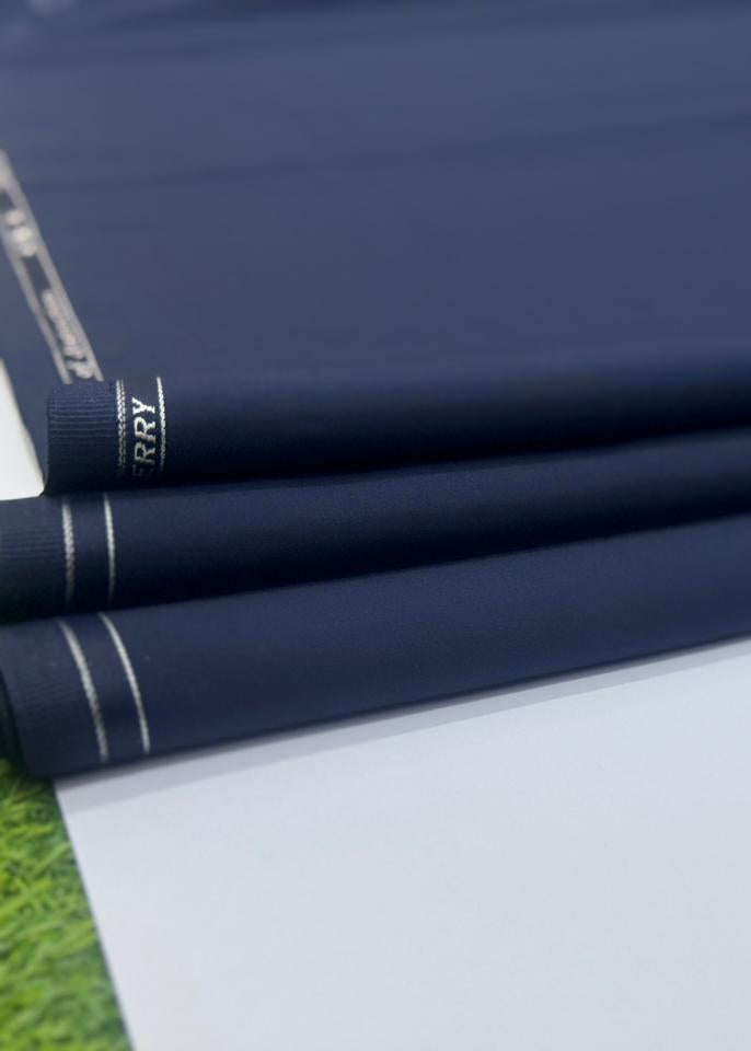 Roll of dark blue fabric with a brand label on a white background