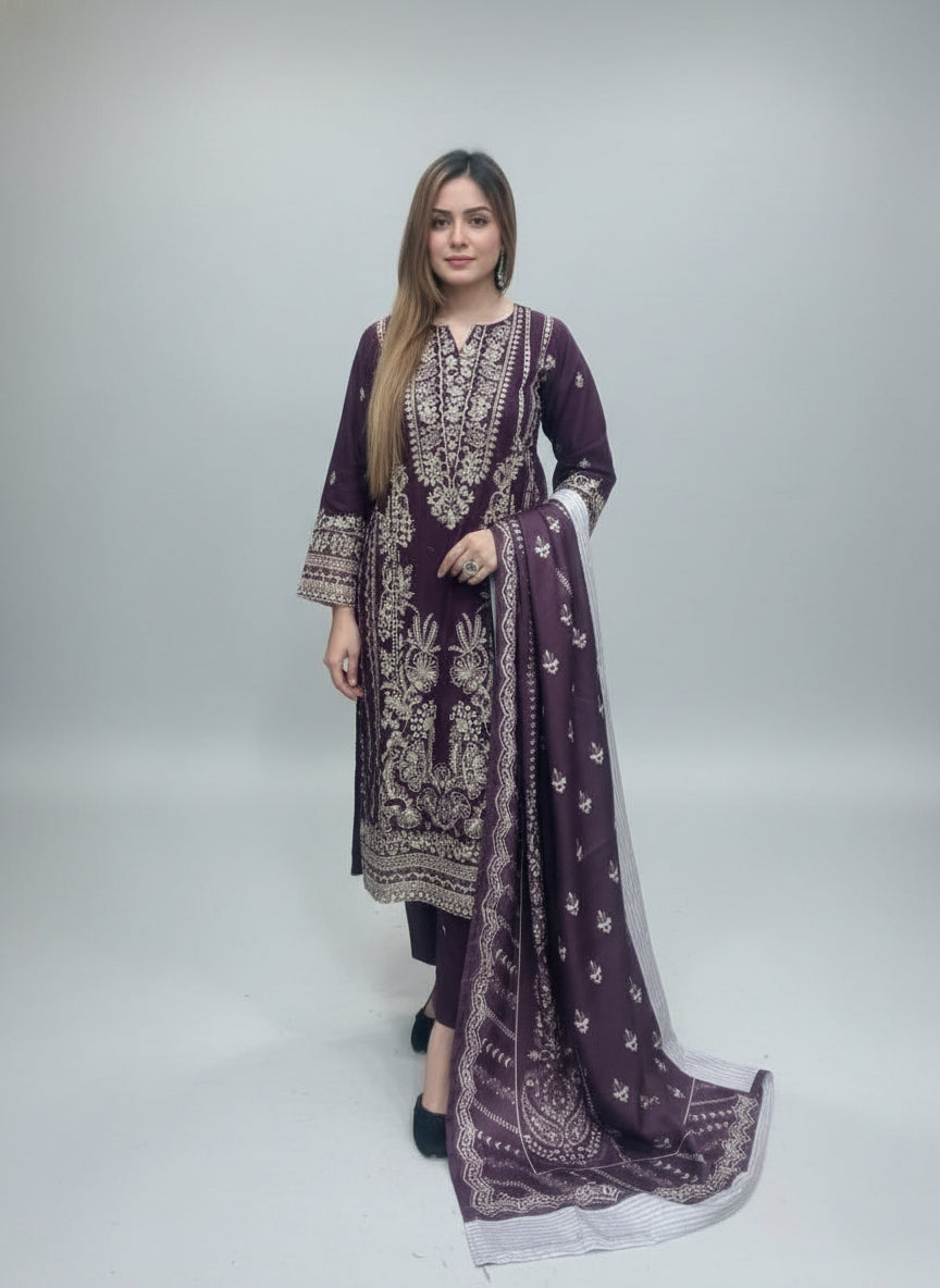 Person wearing a purple embroidered outfit with a green background