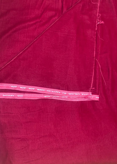 Close-up of red fabric with a clear plastic strip