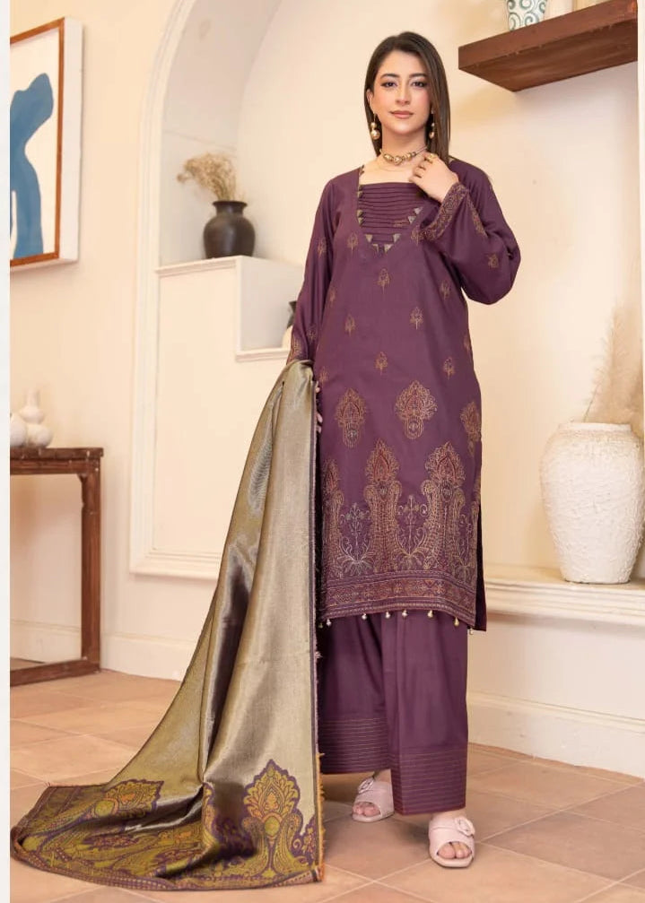Woman in a purple traditional outfit with a matching dupatta in a decorative room.