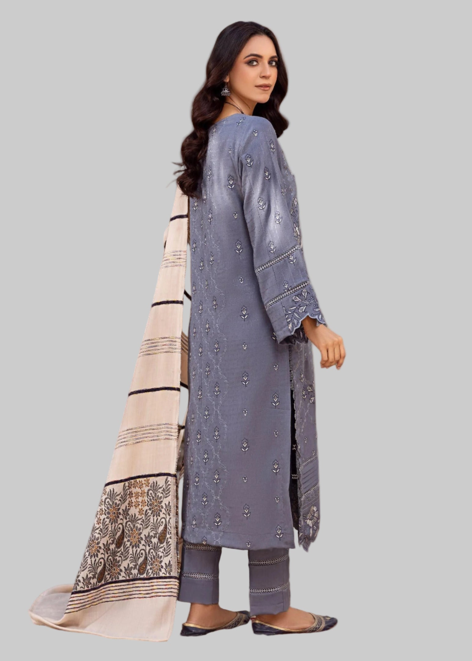 Woman in a blue traditional outfit with a patterned dupatta in a Studio