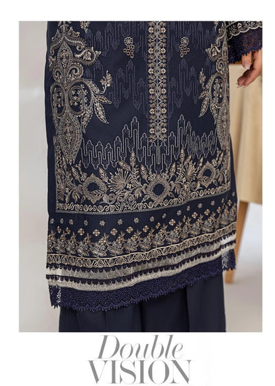 Woman wearing a navy blue embroidered outfit with a close-up of the fabric.